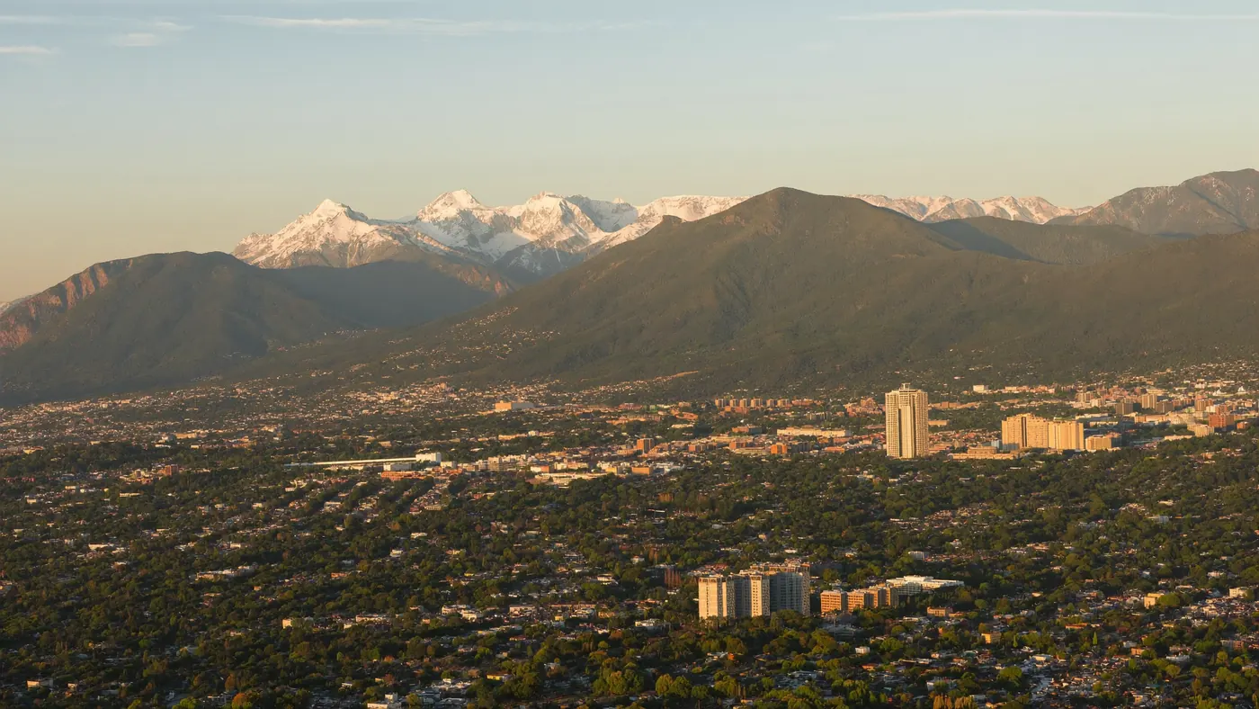 Aerial view along the Colorado Front Range with metro neighborhoods below the Rocky Mountains