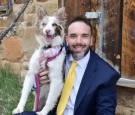 Cory Strauch outdoors in Colorado with his dog